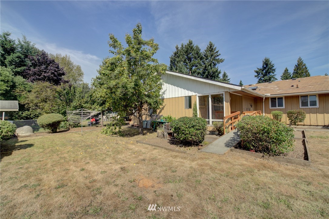6721 Northeast 2nd Place Renton, WA 98059 - Photo 22 of 25 front view of a house with a yard