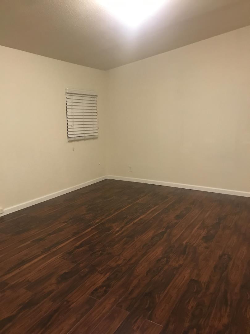 2151 Oakland Road, Unit 445 San Jose, CA 95131 - Photo 16 of 20 an empty room with wooden floor and windows