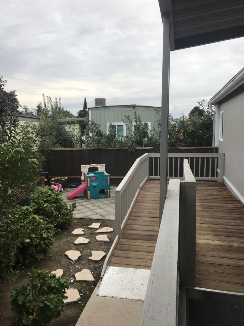 2151 Oakland Road, Unit 445 San Jose, CA 95131 - Photo 18 of 20 a view of a balcony with wooden floor and fence
