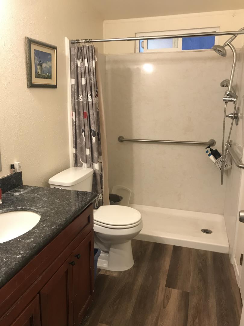 2151 Oakland Road, Unit 445 San Jose, CA 95131 - Photo 4 of 20 a bathroom with a granite countertop sink toilet and shower