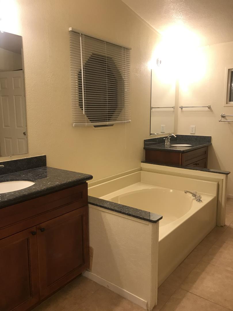 2151 Oakland Road, Unit 445 San Jose, CA 95131 - Photo 5 of 20 a bathroom with a sink and a mirror