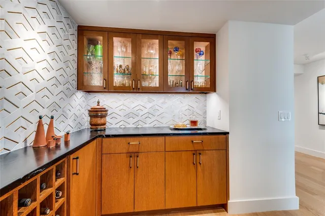 a view of a kitchen with wooden floor and cabinet