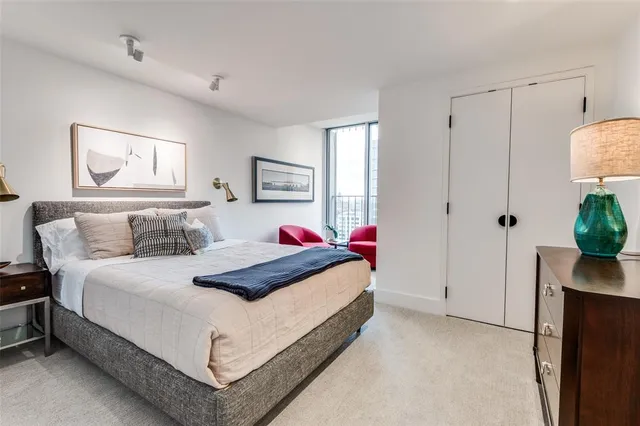 a bedroom with bed and window