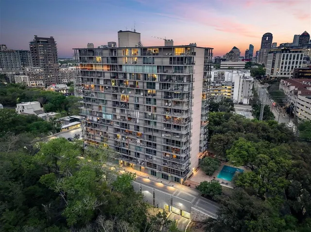 a balcony with trees in front of it