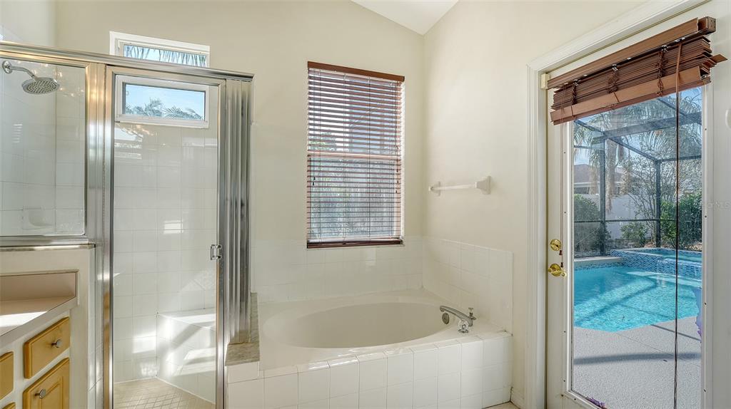 6213 Willet Court Lakewood Ranch, FL 34202 - Photo 23 of 74 a bathroom with a bathtub and a shower