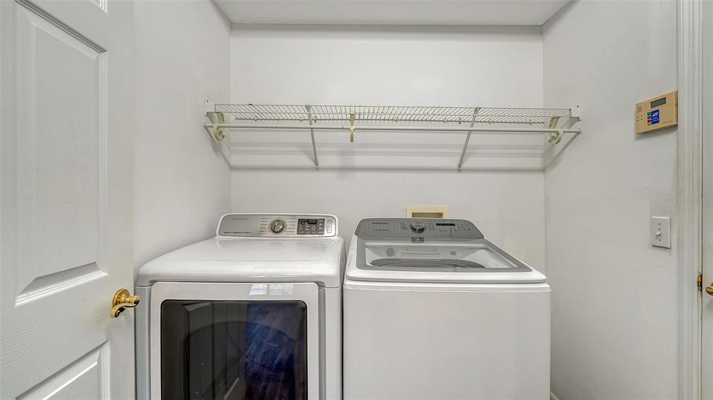6213 Willet Court Lakewood Ranch, FL 34202 - Photo 29 of 74 a utility room with dryer and washer