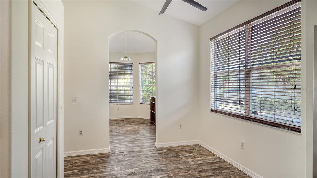 6213 Willet Court Lakewood Ranch, FL 34202 - Photo 3 of 74 a view of an empty room with wooden floor and a window