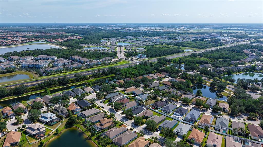 6213 Willet Court Lakewood Ranch, FL 34202 - Photo 41 of 74 an aerial view of a city with lots of residential buildings
