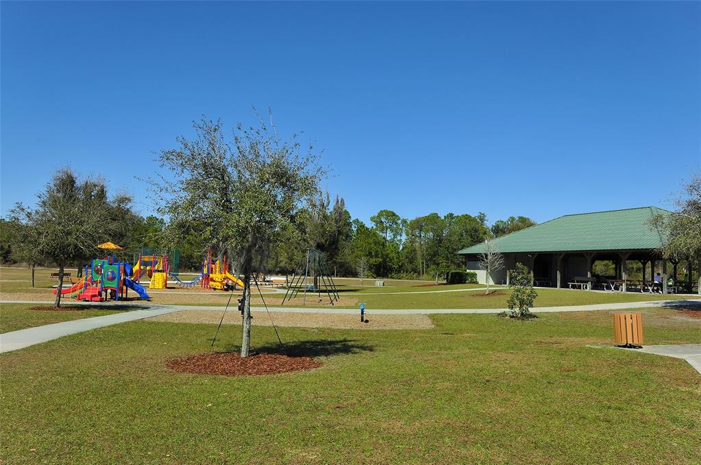 6213 Willet Court Lakewood Ranch, FL 34202 - Photo 52 of 74 a view of a park with swings and slides