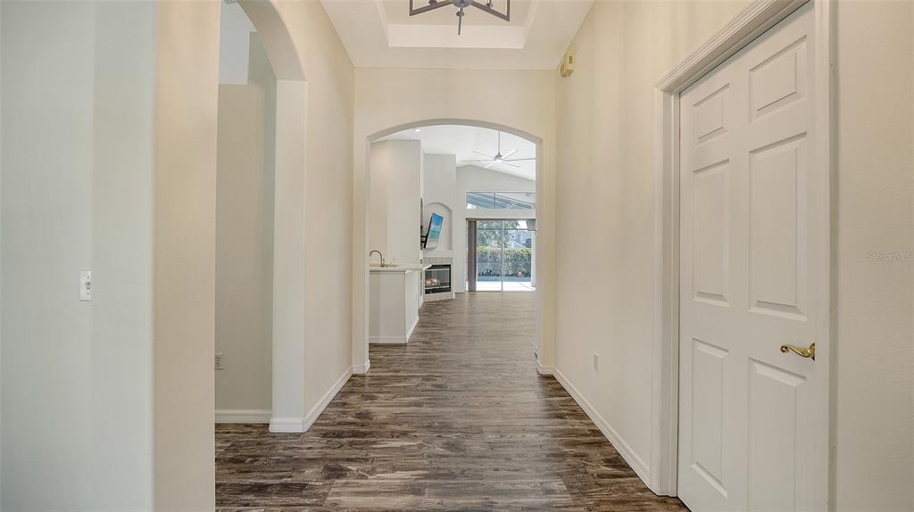 6213 Willet Court Lakewood Ranch, FL 34202 - Photo 8 of 74 a view of a hallway with wooden floor