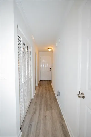a view of a room with wooden floor