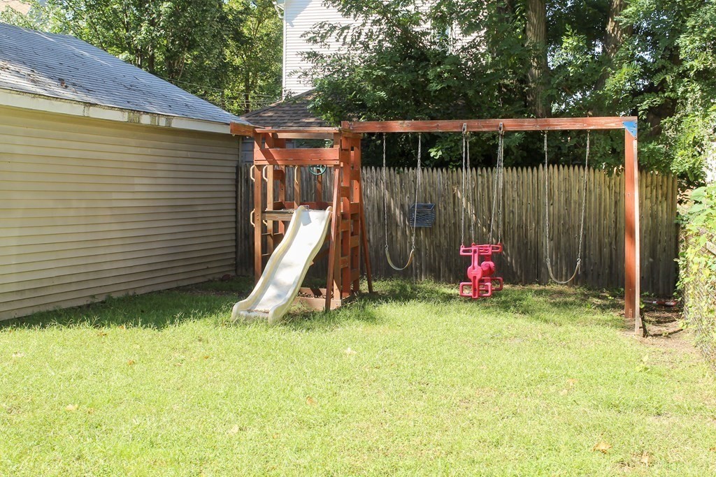 14 Cleveland Street Springfield, MA 01104 - Photo 14 of 14 a view of a backyard with a small cabin and a chair