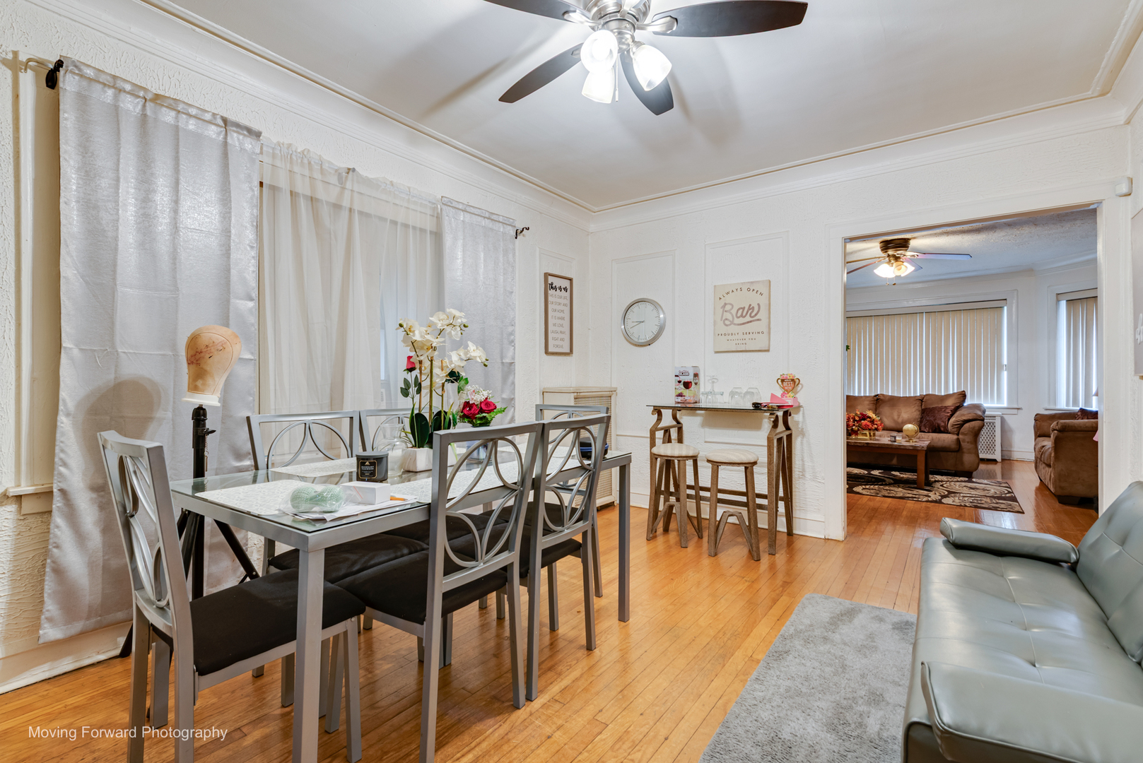 8213 South Indiana Avenue Chicago, IL 60619 - Photo 6 of 25 a view of a dining room with furniture and wooden floor