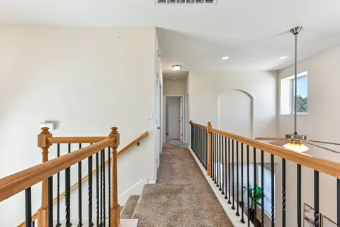 a view of a hallway with staircase