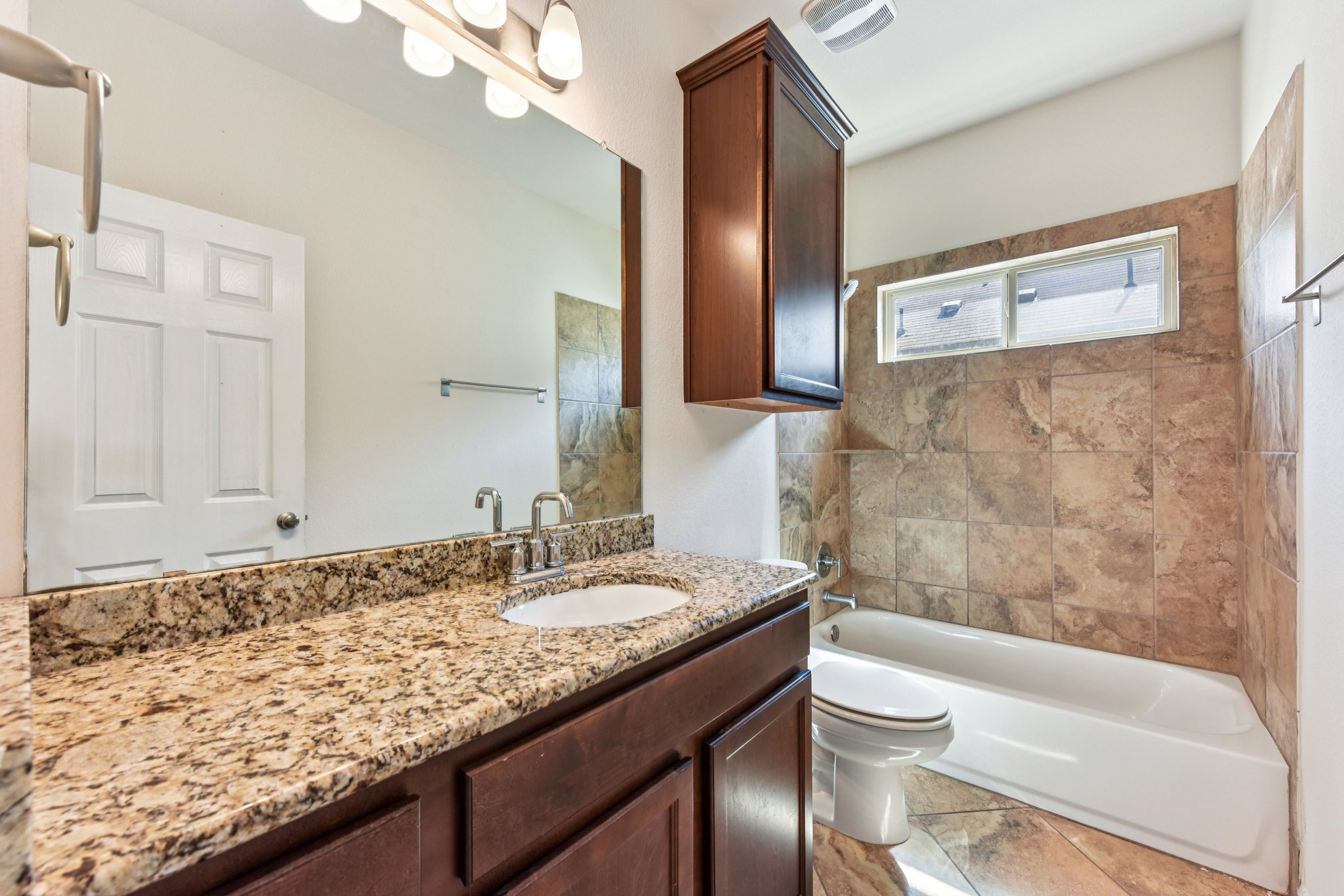 919 Boatswain Way Austin, TX 78748 - Photo 23 of 30 Another full bathroom is near the secondary bedrooms.