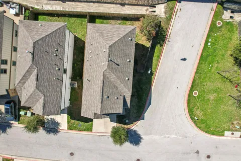 an aerial view of a house with garden
