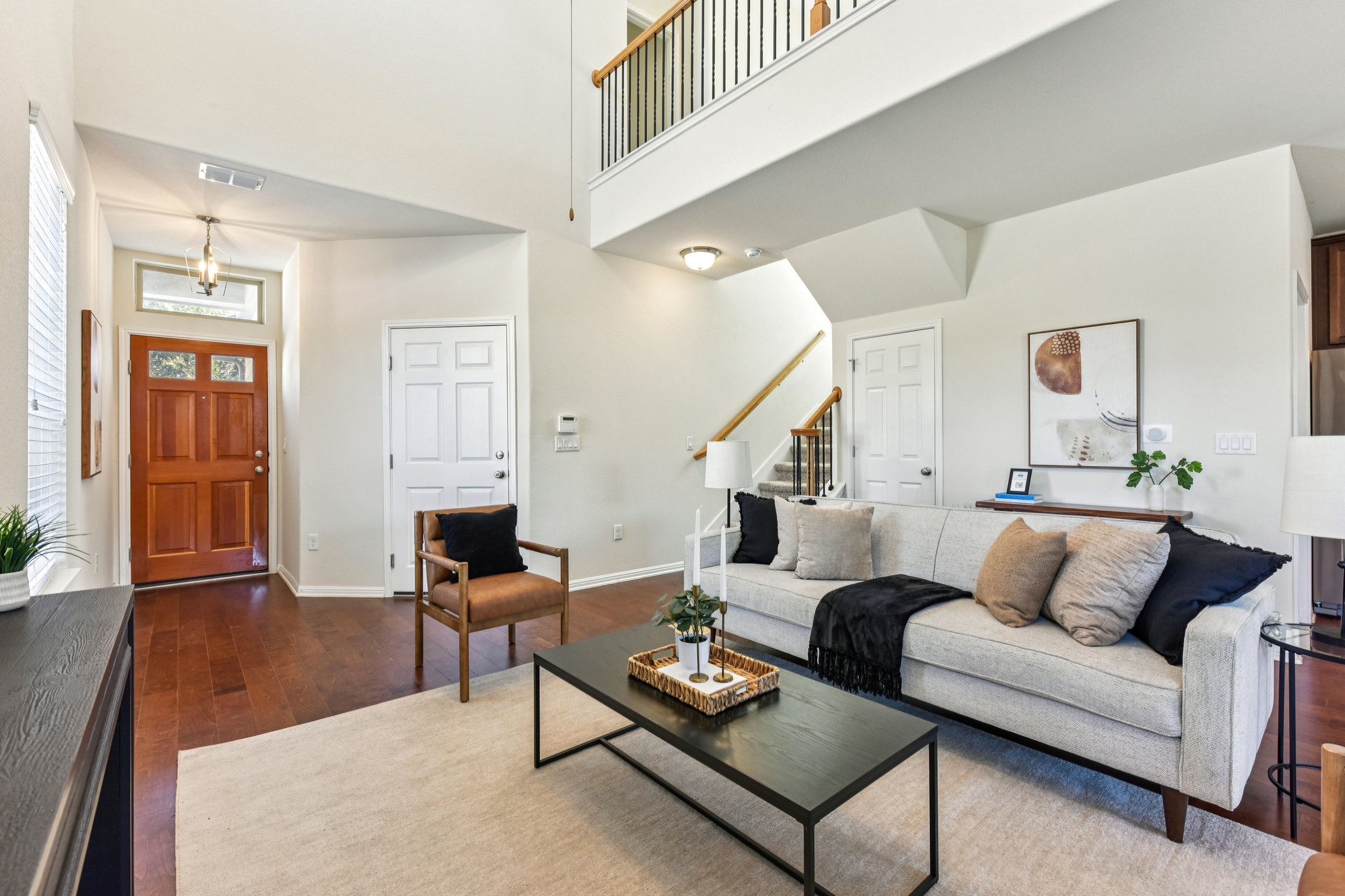 919 Boatswain Way Austin, TX 78748 - Photo 9 of 30 A cozy living setup with plenty of room to spread out, plus the upstairs overlook makes the space feel even bigger.