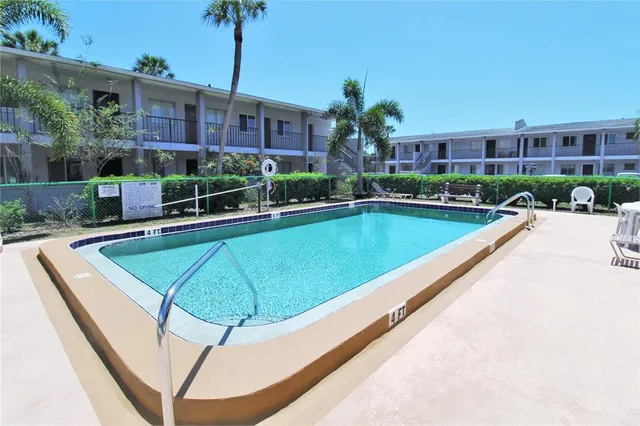 a view of a swimming pool with a patio