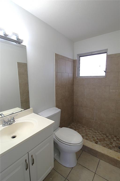 3101 Bee Ridge Road, Unit 215 Sarasota, FL 34239 - Photo 10 of 15 a bathroom with a sink a toilet and shower