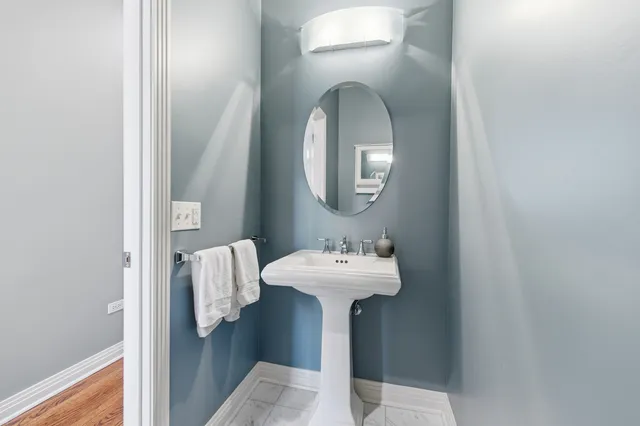 a bed room with a bed and a chair