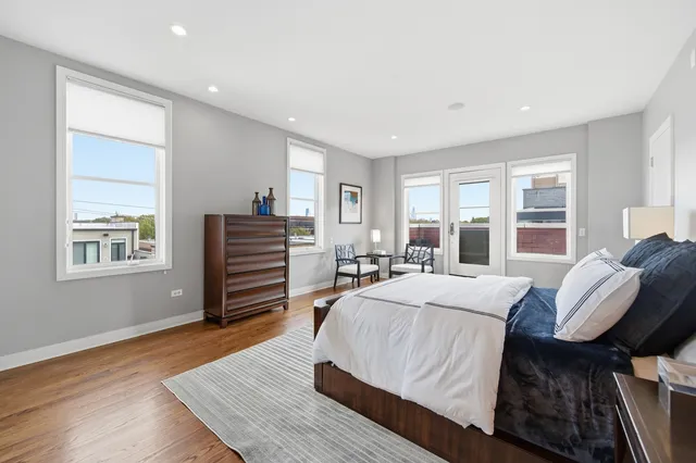 a bedroom with a large bed and a couch