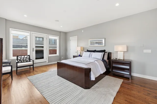 a view of roof deck with furniture and a fireplace