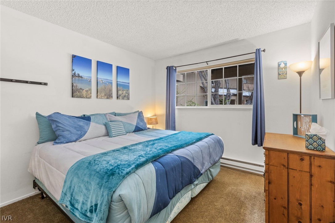 321 Ski Way, Unit 13 Incline Village, NV 89451 - Photo 16 of 26 a bedroom with bed and window