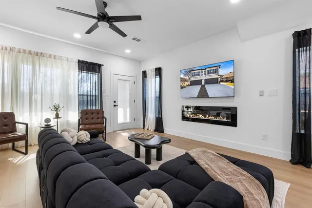 a living room with furniture and a fireplace