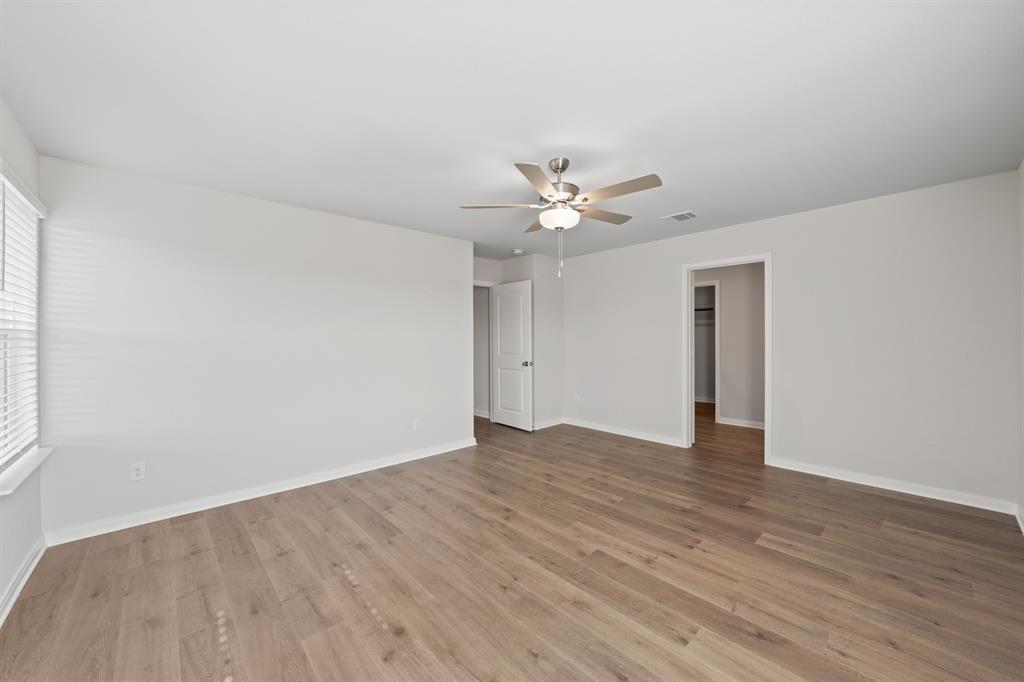 137 Magnolia Boulevard Hutchins, TX 75141 - Photo 5 of 8 a view of an empty room with wooden floor