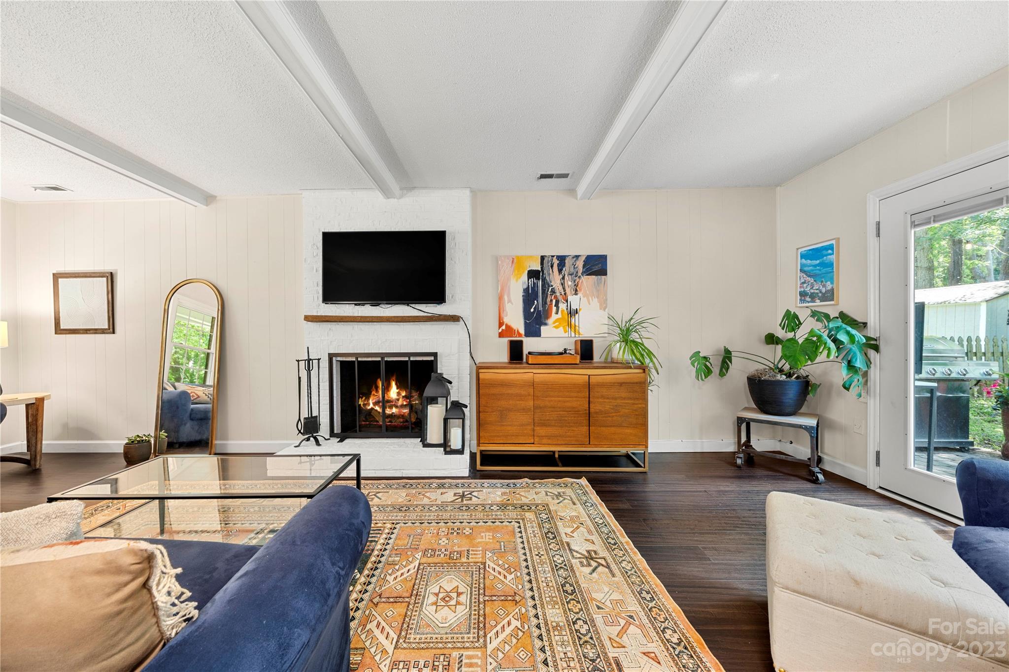 6433 Round Hill Road Charlotte, NC 28211 - Photo 11 of 33 a living room with furniture and a fireplace