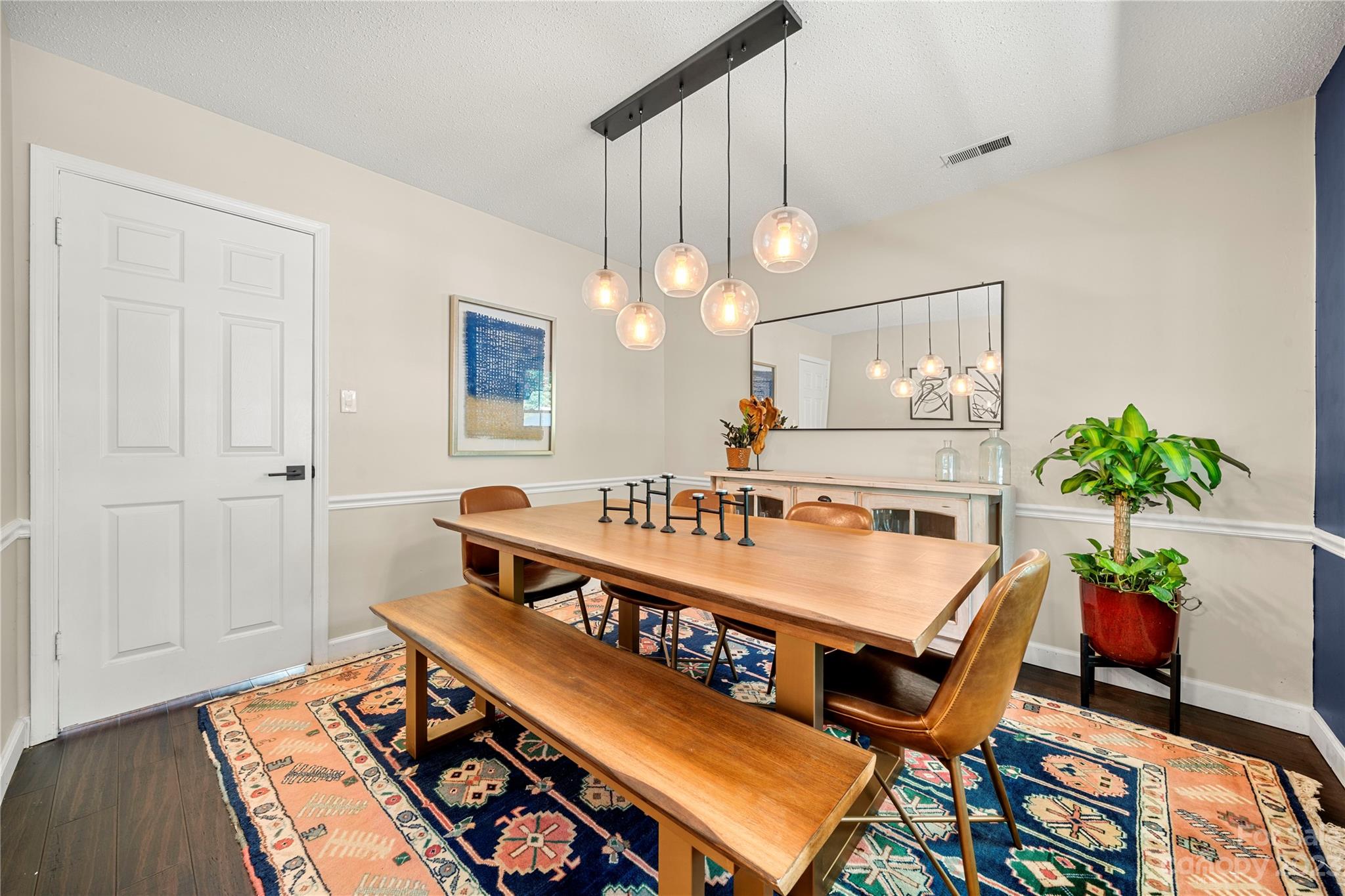 6433 Round Hill Road Charlotte, NC 28211 - Photo 14 of 33 a view of a dining room with furniture and wooden floor