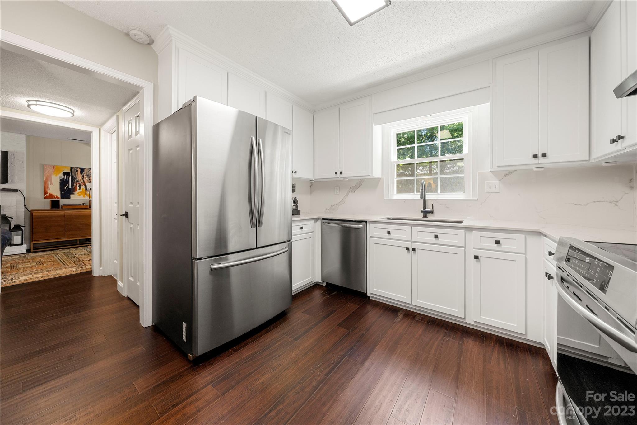 6433 Round Hill Road Charlotte, NC 28211 - Photo 17 of 33 a kitchen with cabinets stainless steel appliances a sink and a window