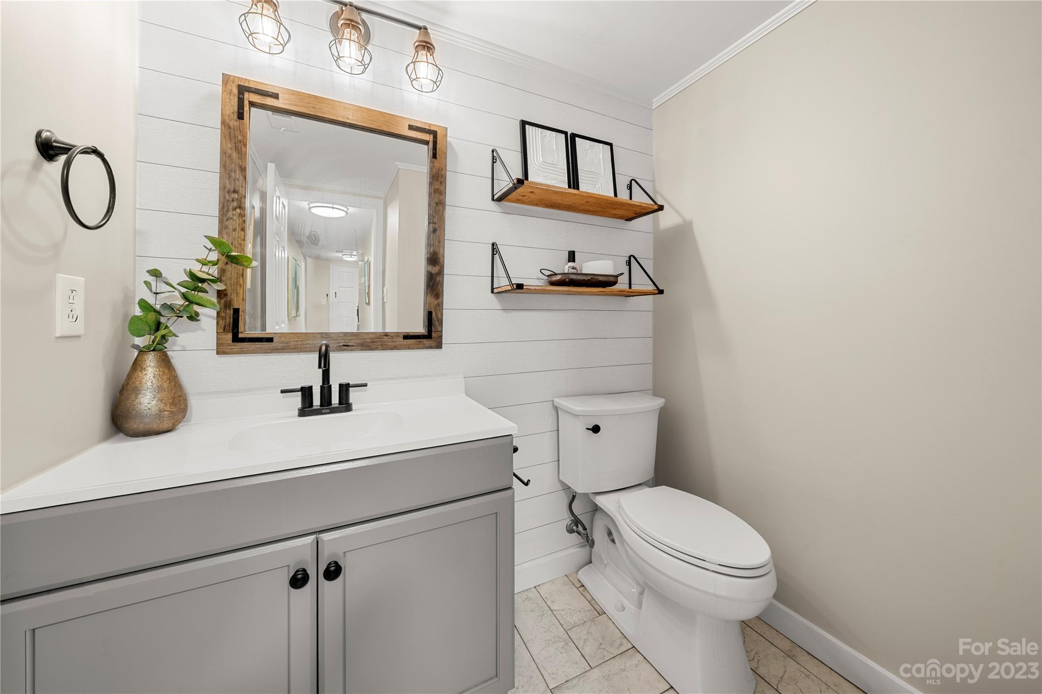 6433 Round Hill Road Charlotte, NC 28211 - Photo 19 of 33 a bathroom with a toilet sink and mirror