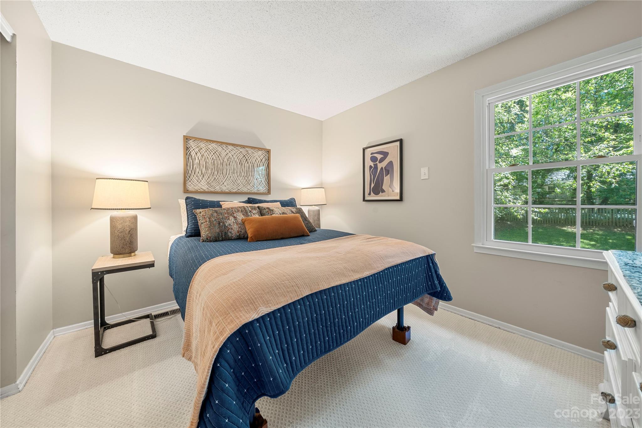 6433 Round Hill Road Charlotte, NC 28211 - Photo 21 of 33 a bedroom with a bed and a painting on the wall