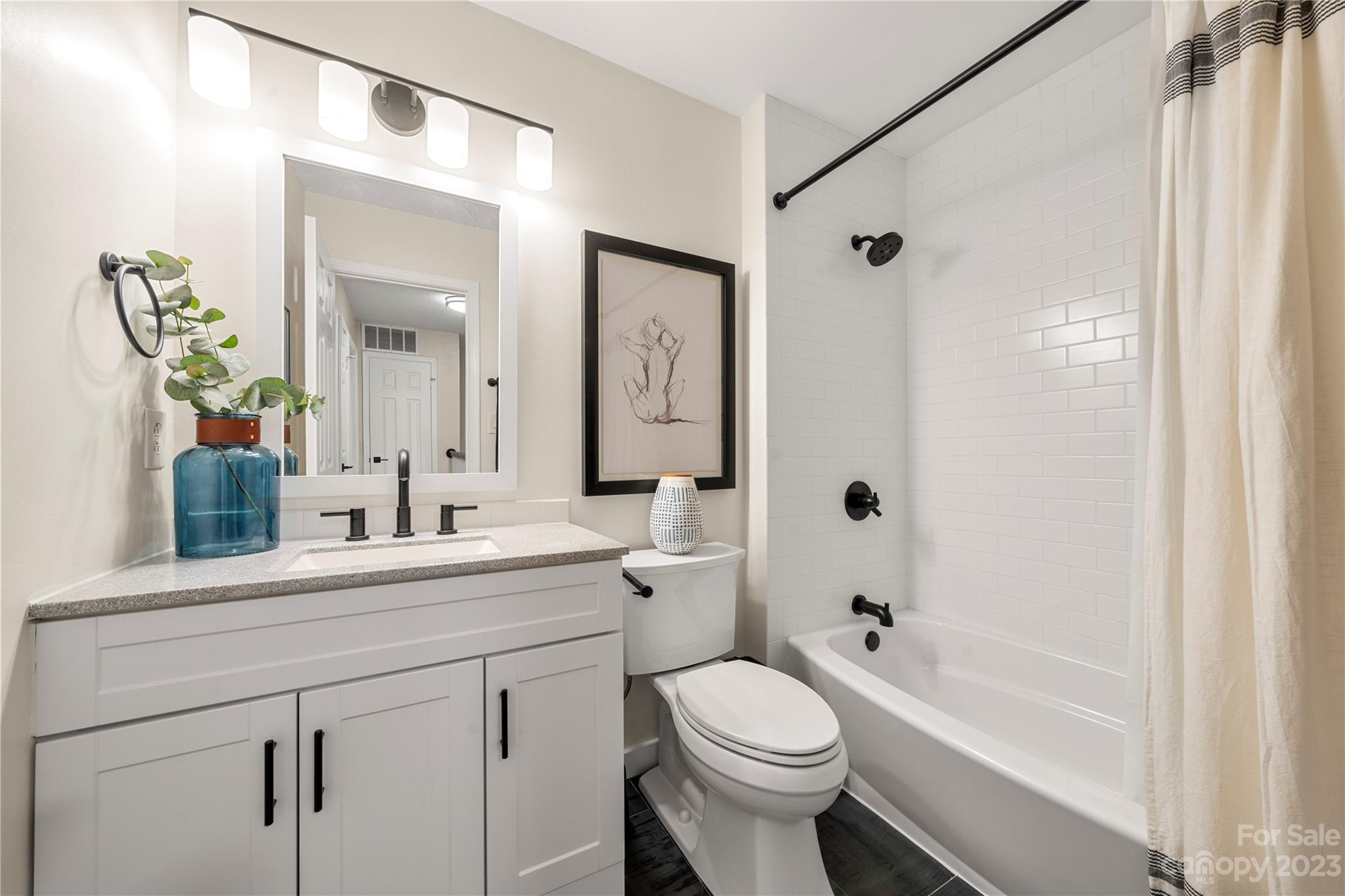 6433 Round Hill Road Charlotte, NC 28211 - Photo 22 of 33 a bathroom with a sink a toilet and shower