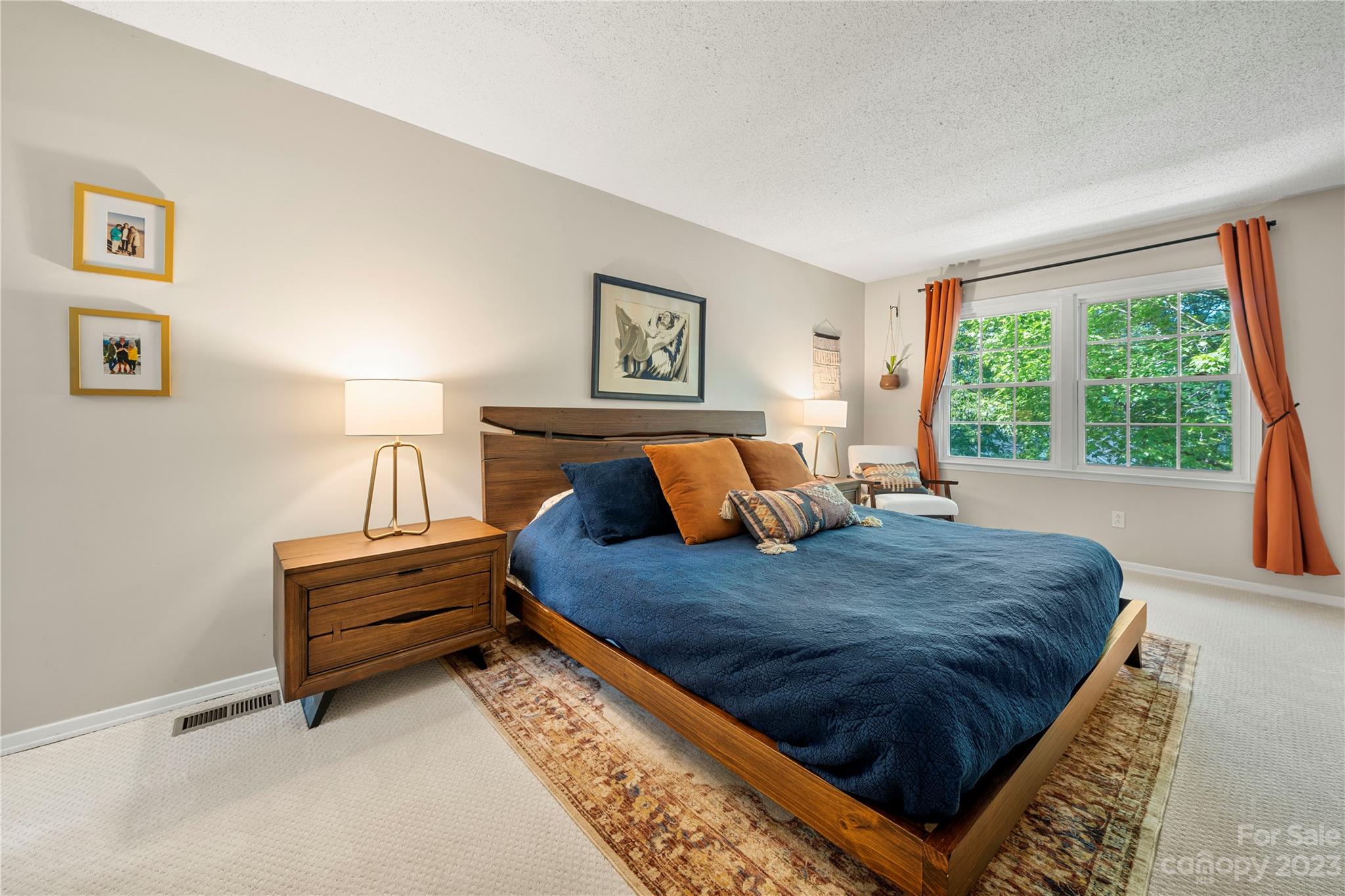 6433 Round Hill Road Charlotte, NC 28211 - Photo 23 of 33 a bed sitting in a bedroom next to a window