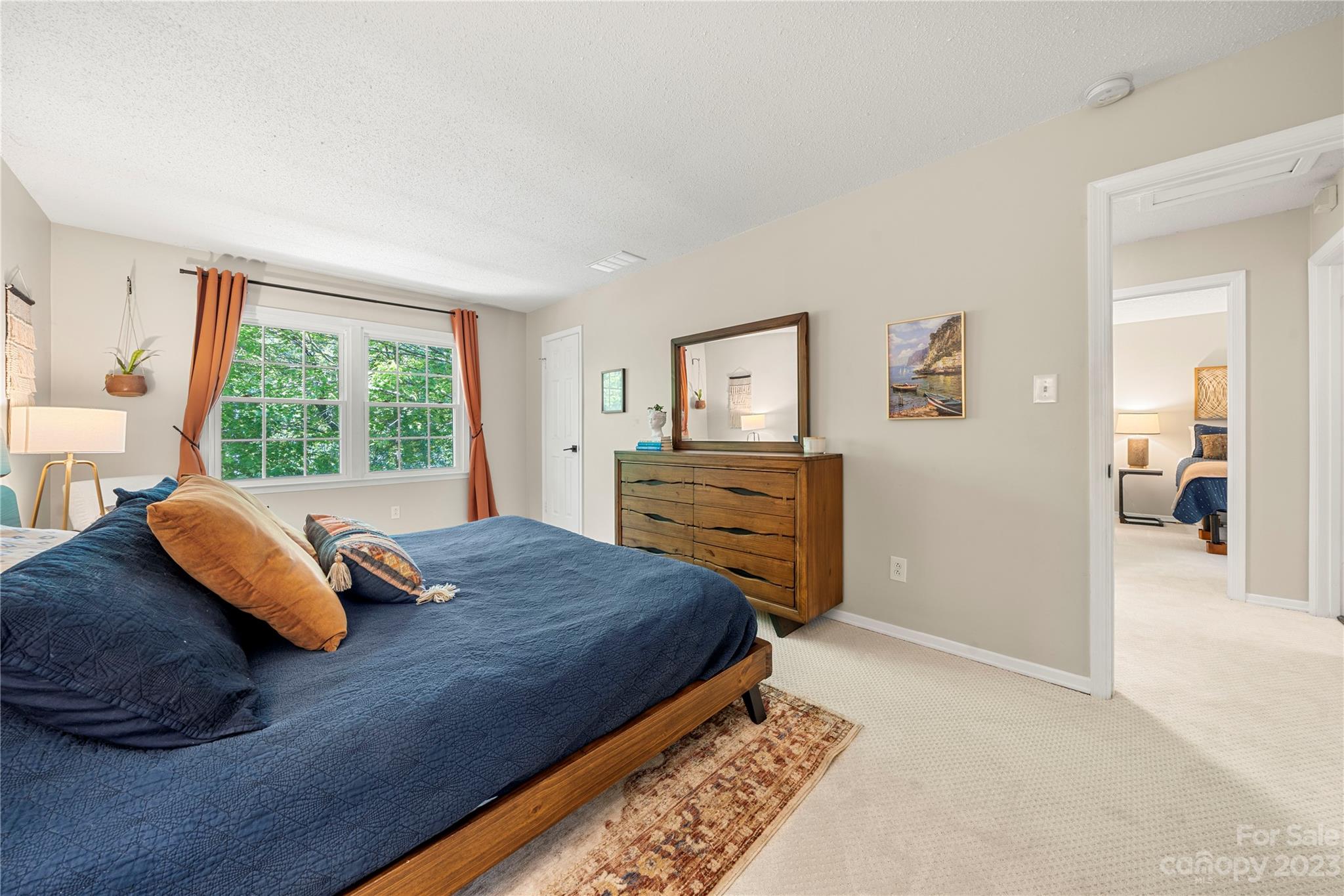 6433 Round Hill Road Charlotte, NC 28211 - Photo 24 of 33 a bed sitting in a bedroom next to a window
