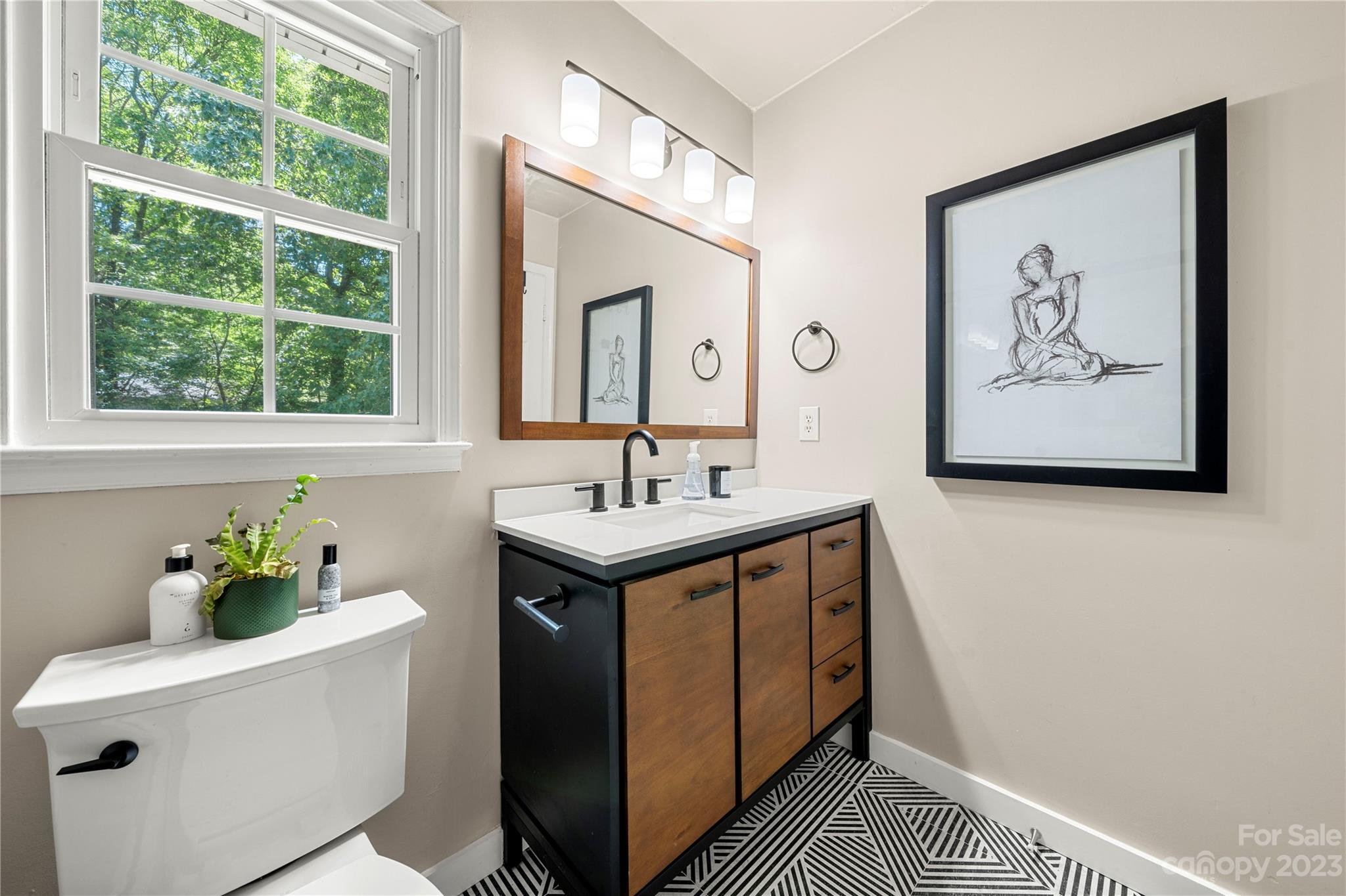 6433 Round Hill Road Charlotte, NC 28211 - Photo 26 of 33 a bathroom with a sink and a mirror