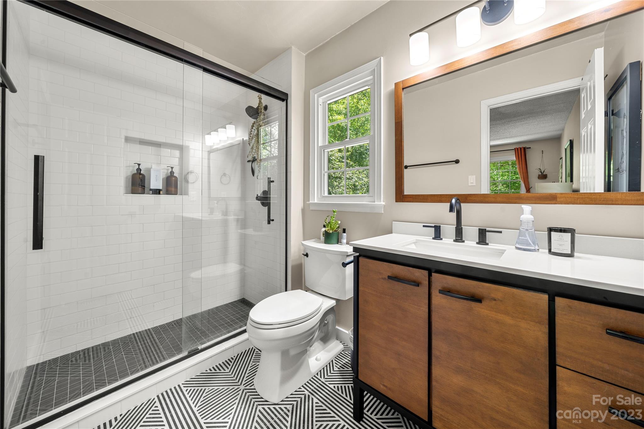 6433 Round Hill Road Charlotte, NC 28211 - Photo 27 of 33 a bathroom with a sink toilet and shower
