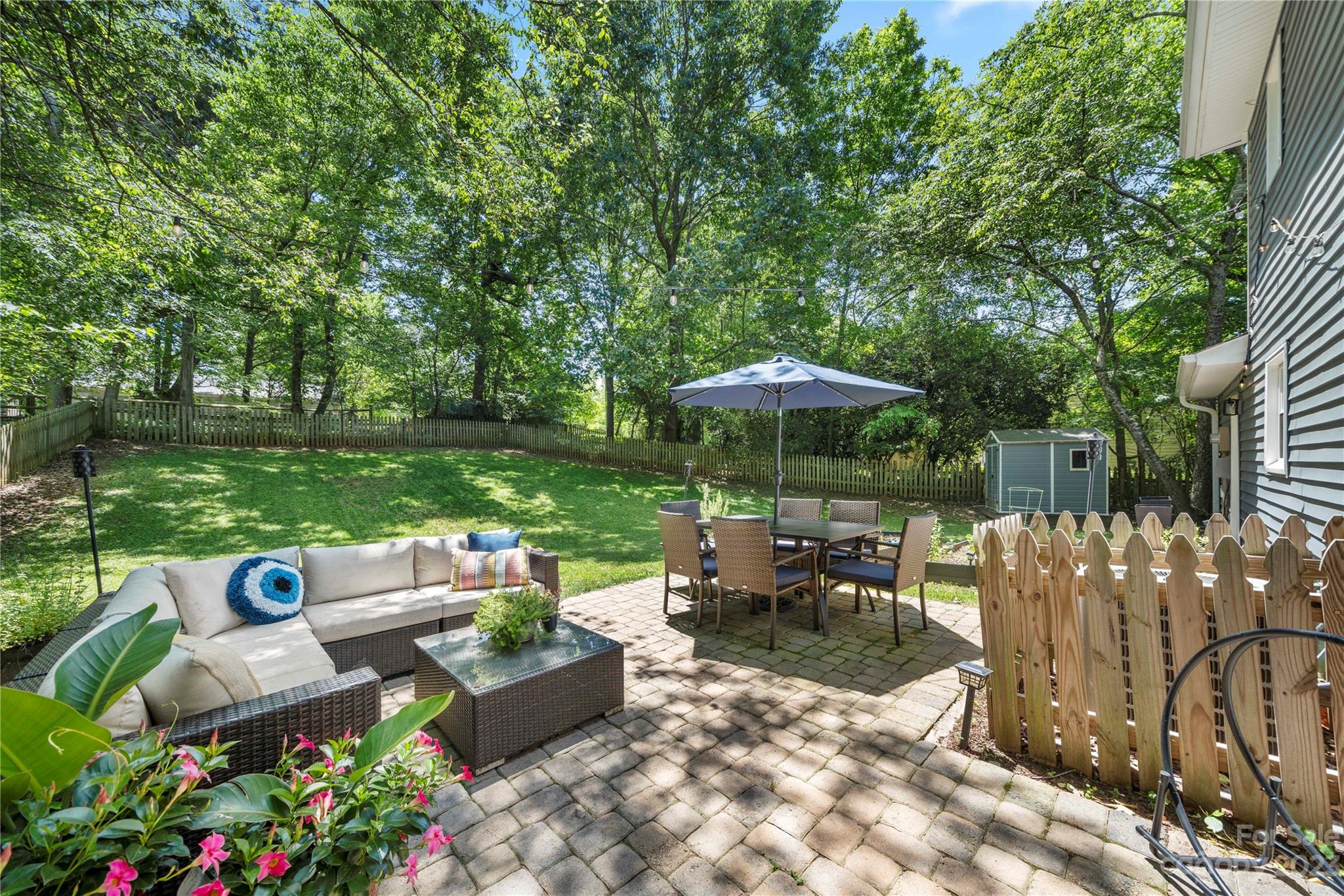 6433 Round Hill Road Charlotte, NC 28211 - Photo 33 of 33 a view of table and chairs under an umbrella