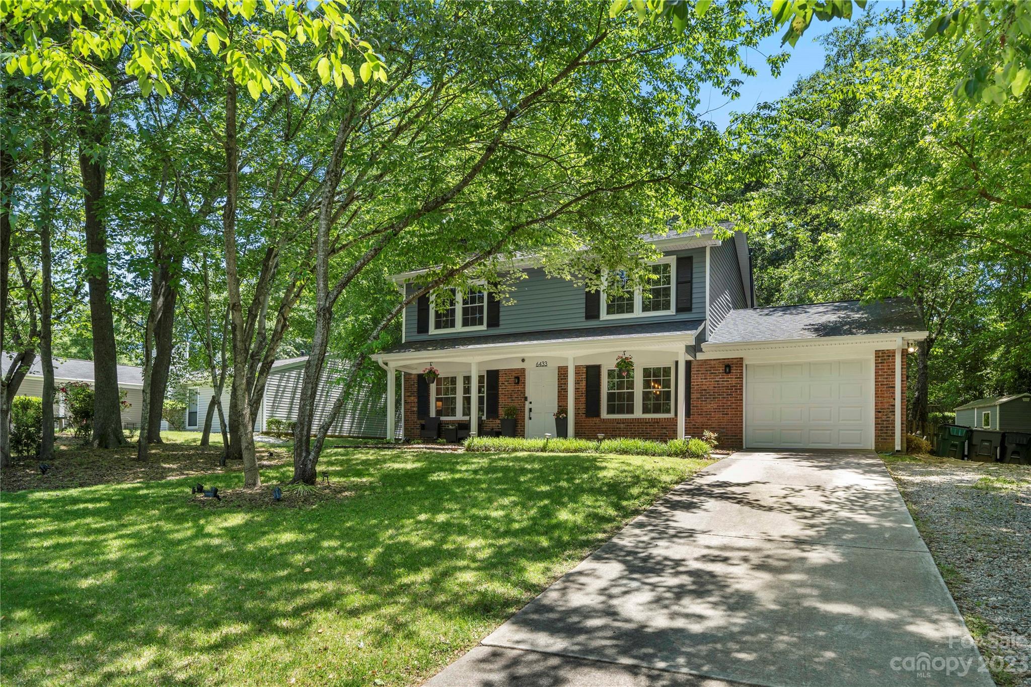 6433 Round Hill Road Charlotte, NC 28211 - Photo 4 of 33 a front view of a house with a yard