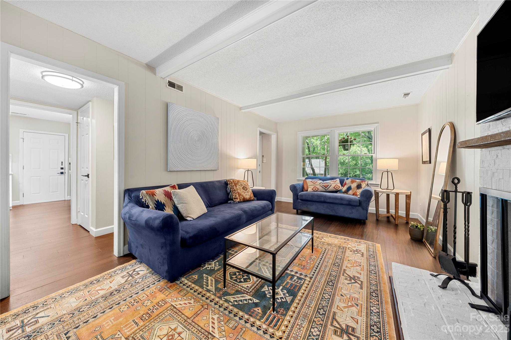 6433 Round Hill Road Charlotte, NC 28211 - Photo 10 of 33 a living room with furniture and a flat screen tv