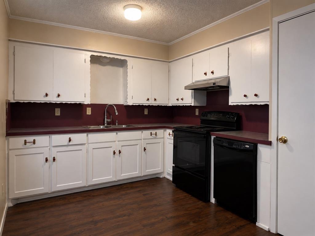 2111 Quail Run, Unit A McKinney, TX 75071 - Photo 6 of 12 a kitchen with stainless steel appliances a stove refrigerator sink and cabinets