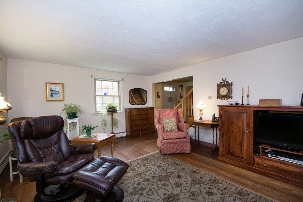 29 Hilltop Road Scituate, MA 02066 - Photo 12 of 22 a living room with furniture and a flat screen tv