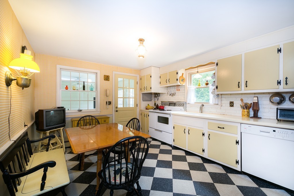 29 Hilltop Road Scituate, MA 02066 - Photo 6 of 22 a kitchen with stainless steel appliances granite countertop a stove a sink and a refrigerator