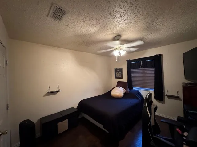 a bedroom with furniture and a window