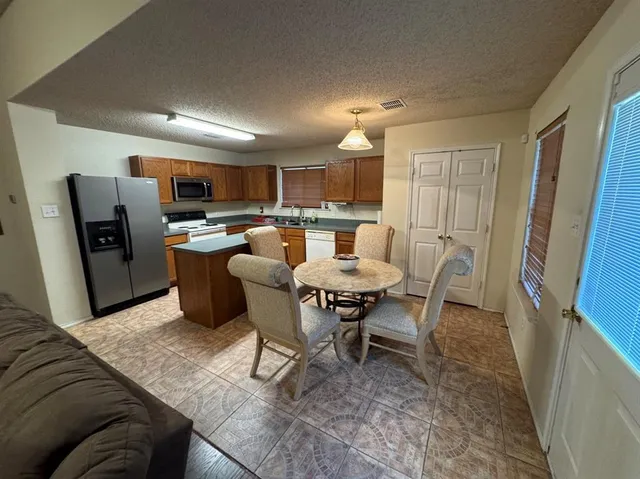 a view of a dining room with furniture