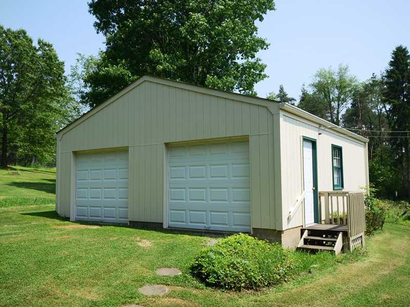 2732 McMorran Road Gibsonia, PA 15044 - Photo 14 of 22 Parking Lot/Garage. Oversized double detached garage, new doors, new roof, electric, with the possibility of second story.