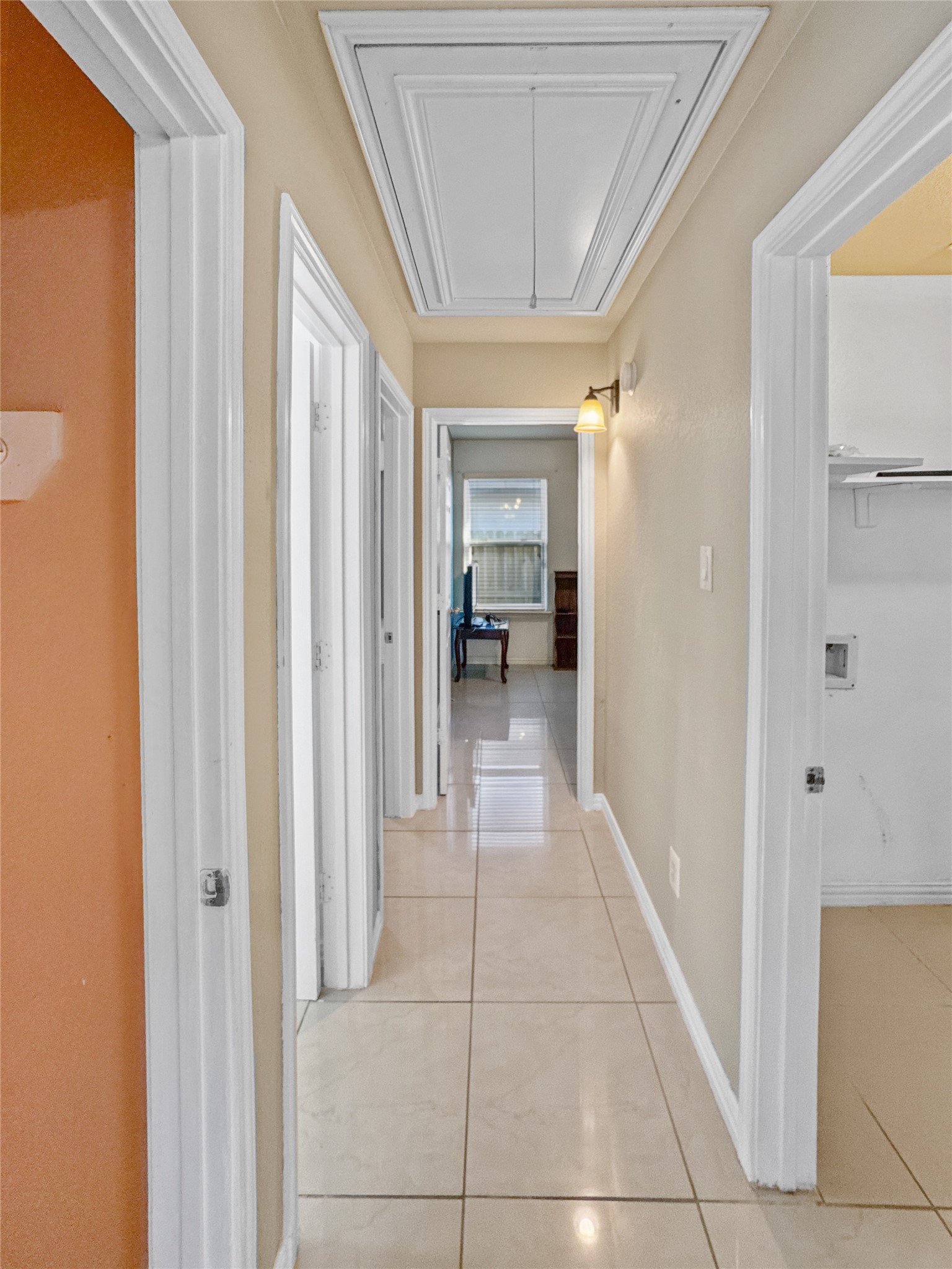6614 Pine Tree Springs Houston, TX 77049 - Photo 11 of 14 a view of a hallway with a livingroom and a bathroom