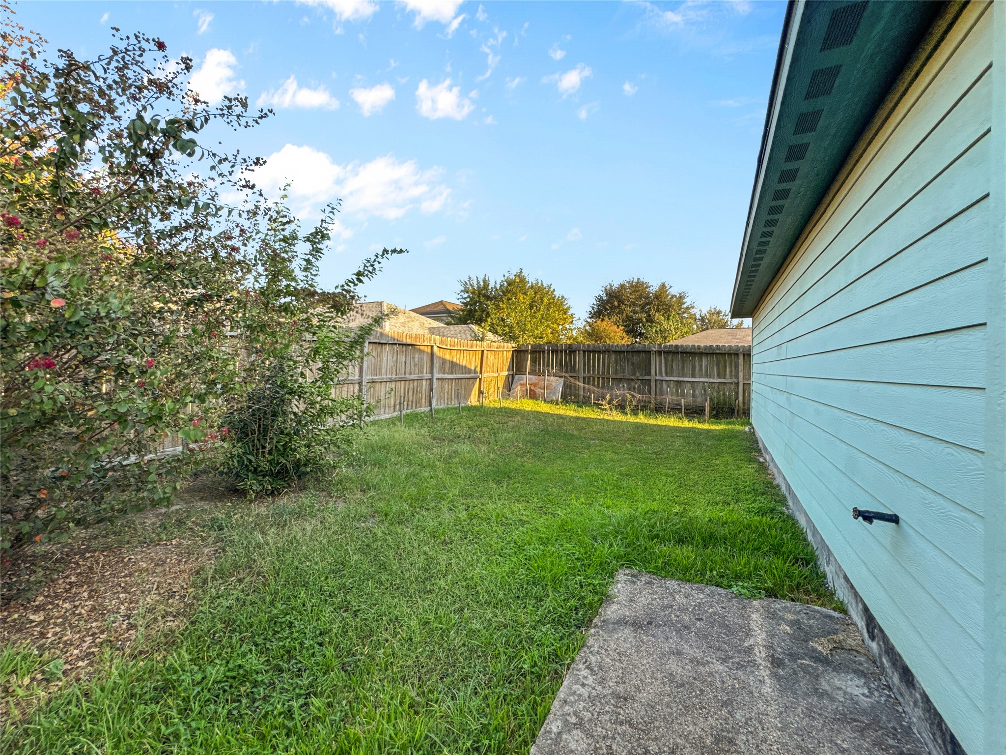 6614 Pine Tree Springs Houston, TX 77049 - Photo 14 of 14 a view of a house with a backyard